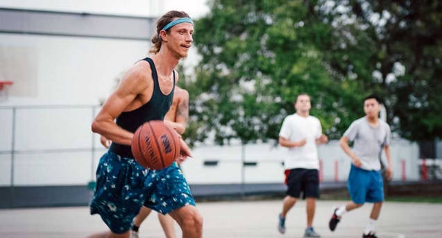 A Resident at the Last House Sober Living in West Los Angeles playing basketball during a saturday house event.