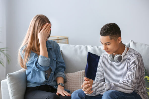 Sad,African-american,Teenage,Boy,Having,Argument,With,His,Mother,At