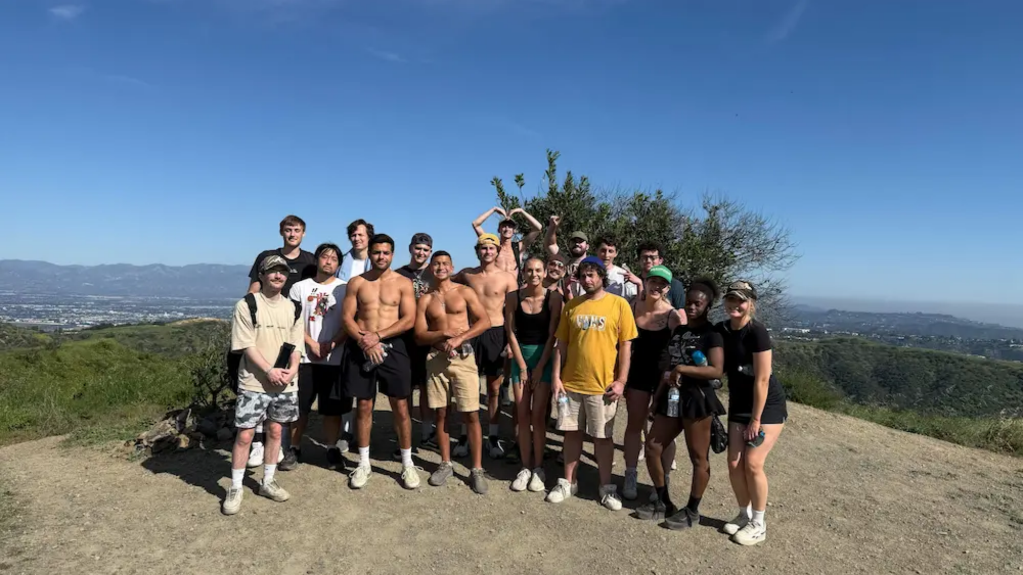 Group of residents on a scenic hike overlooking Los Angeles during sober living program